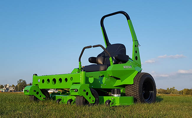 Commercial size Mean Green mower showcased on fresh cut grass.