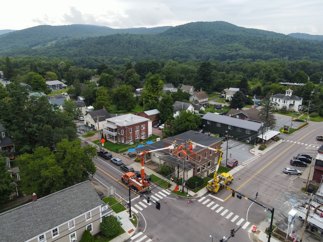 Drone image of Richmond, VT from above, with mountains in the background